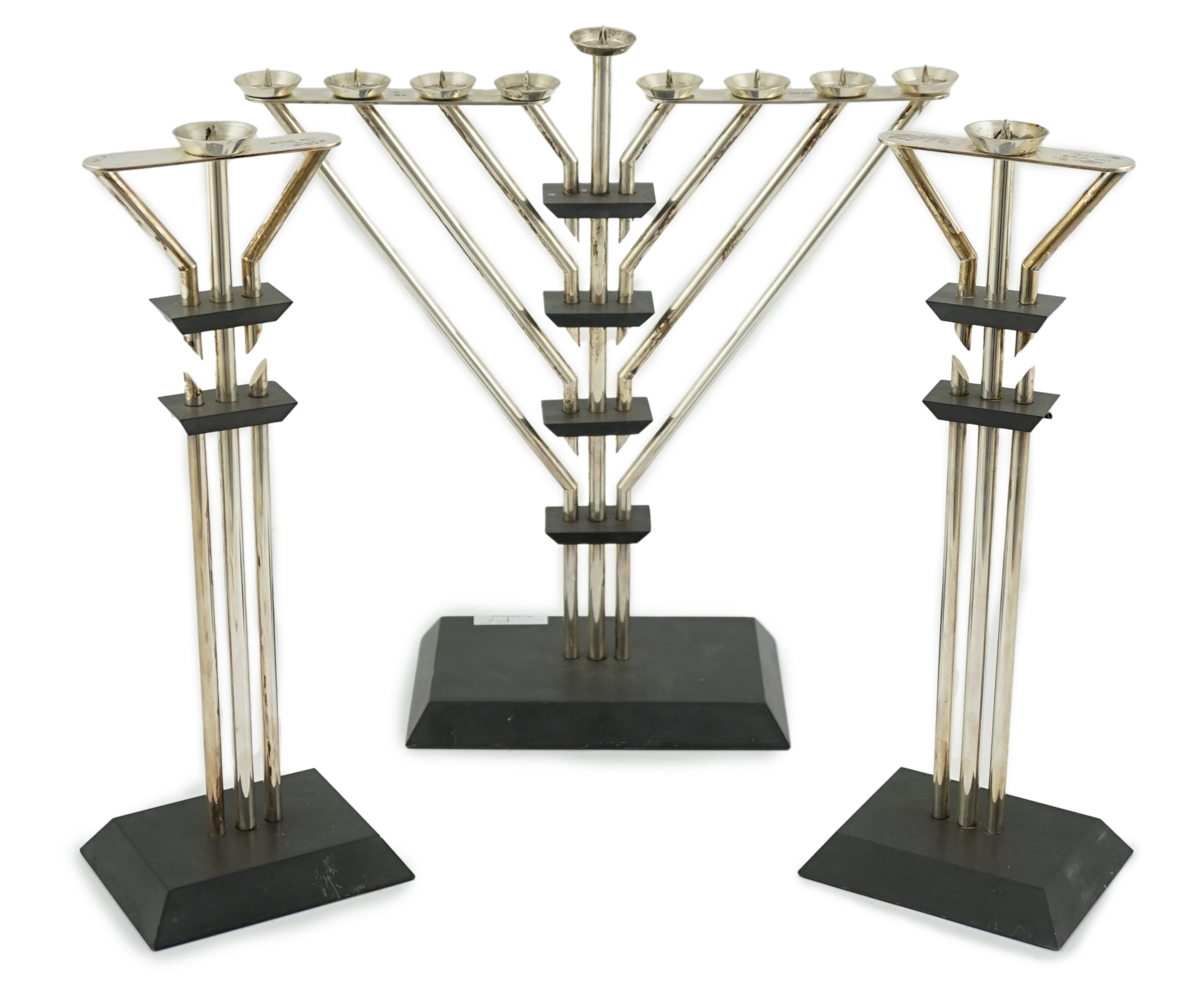 An Elizabeth II silver mounted slate Hanukkah Menorah and a pair of matching candlesticks by Marianne Forest